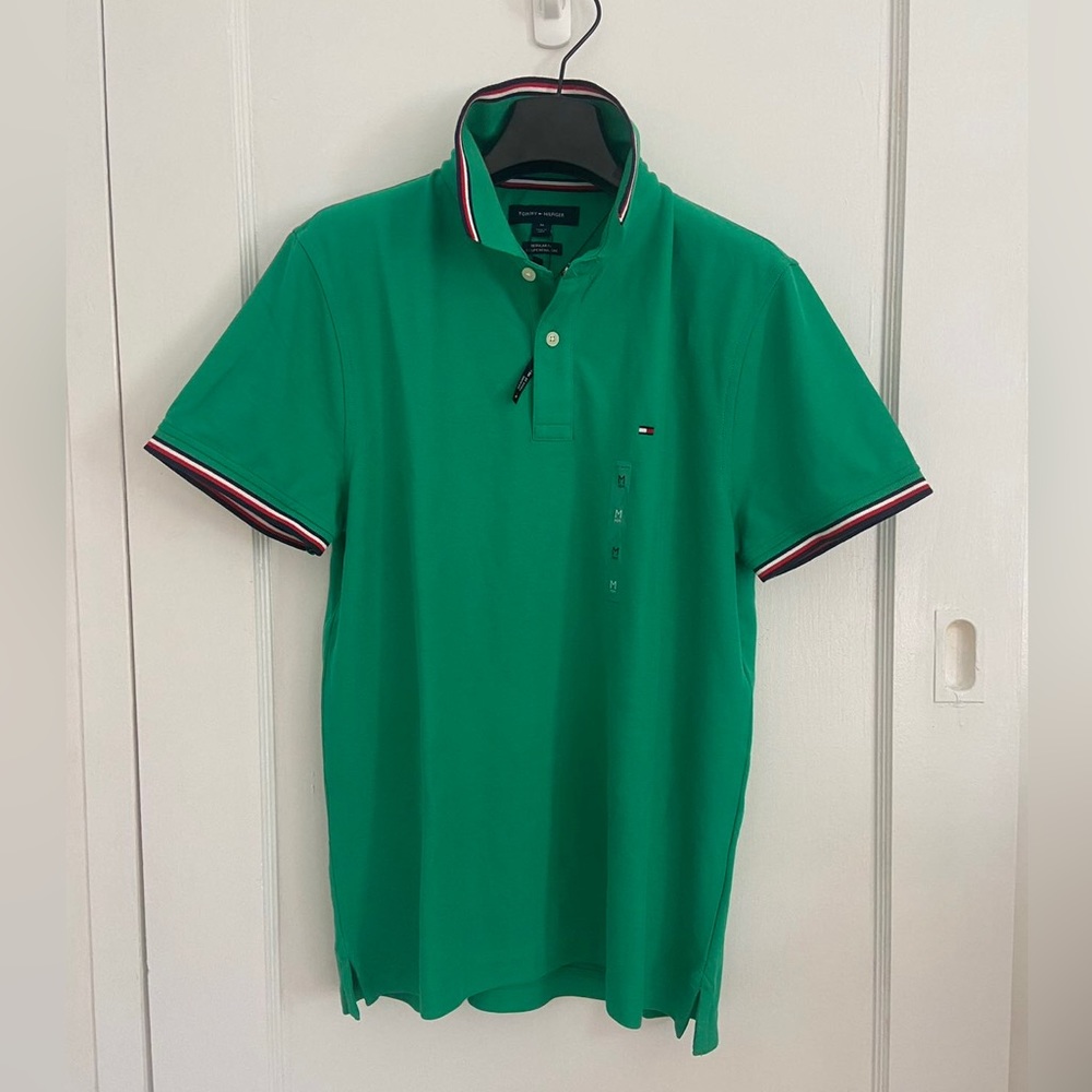 TOMMY HILFIGER MENS
REGULAR FIT TOMMY WICKING POLO SIZE M